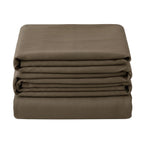 Noctura full blackout curtain folded in a stack on a white background